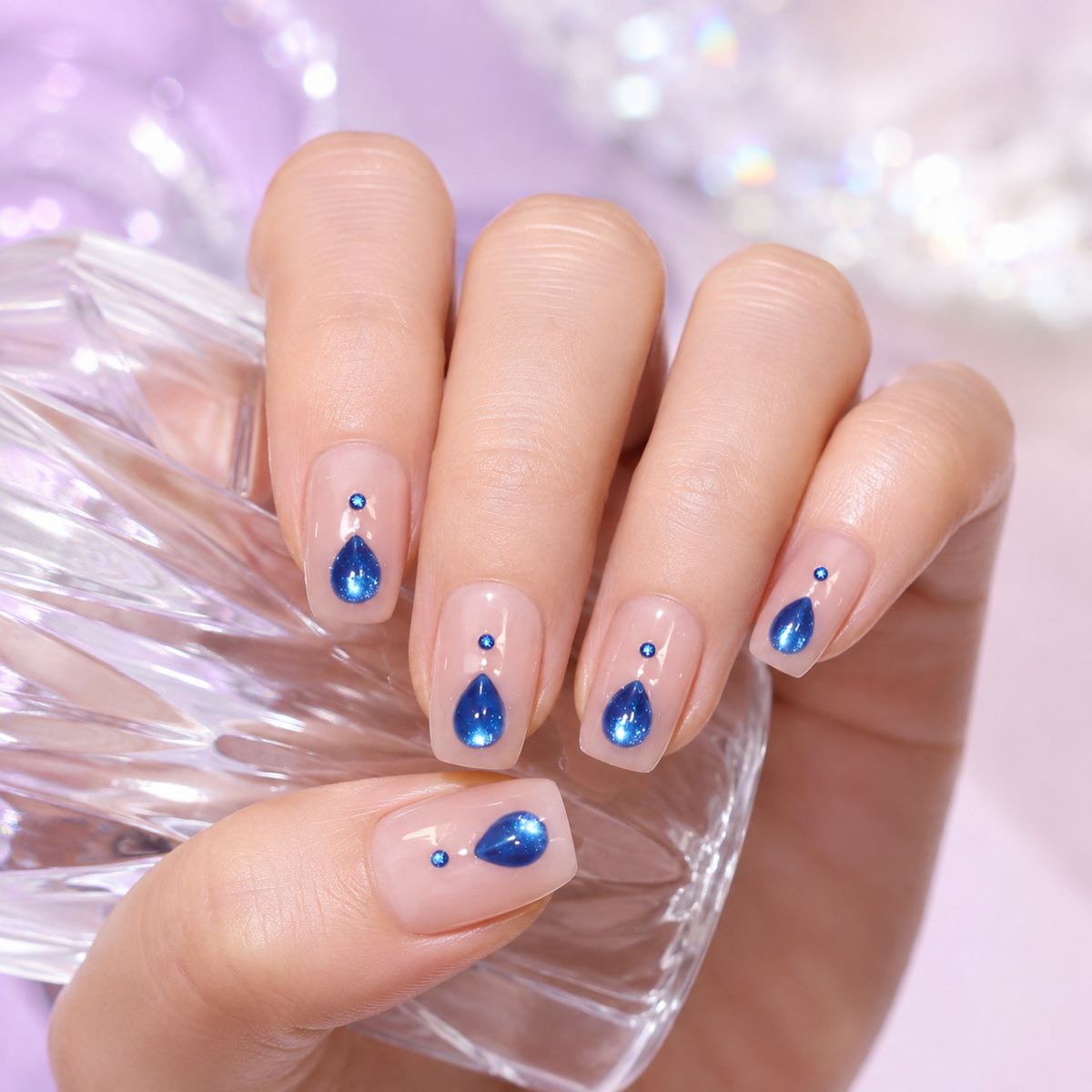 Sapphire Teardrop Nude Pink Press-On Nails, Medium-Length Squoval Tips with Blue Gem Accents