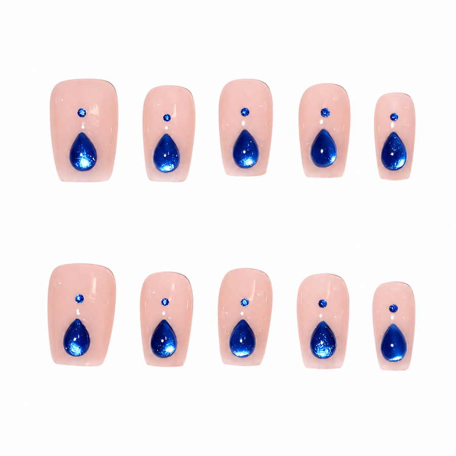 Sapphire Teardrop Nude Pink Press-On Nails, Medium-Length Squoval Tips with Blue Gem Accents